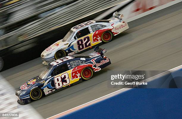 Brian Vickers, driver of the Red Bull Toyota, races teammate Scott Speed, driver of the Red Bull Toyota, during the NASCAR Sprint Cup Series Auto...