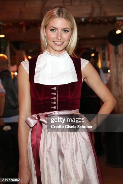 Lena Gercke, wearing a red dirndl by 'Amsel Fashion' during the "BMW Wies'n Sport-Stammtisch" as part of the Oktoberfest at Theresienwiese on...