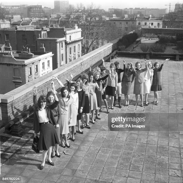 Models who have been chosen to take part in the Berkeley Debutante Dress Show are pictured on the roof of Keyes House in London. From left: Karen...