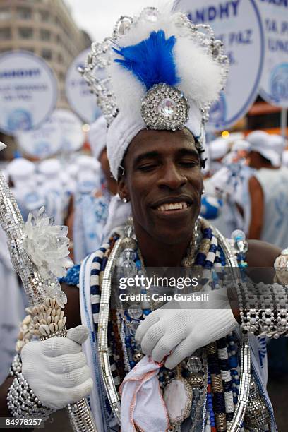 Member of the Filhos de Gandhy carnival group reacts as he and his peers parade in Salvador's downtown streets on February 22, 2009 in Salvador,...