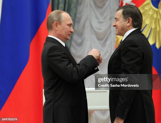 Russian President Vladimir Putin and billionaire Aras Agalarov seen during an awarding ceremony in the Kremlin in Moscow, Russia on October 29, 2013....