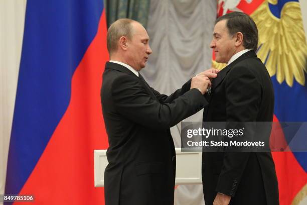 Russian President Vladimir Putin and billionaire Aras Agalarov seen during an awarding ceremony in the Kremlin in Moscow, Russia on October 29, 2013....