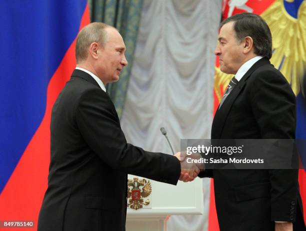 Russian President Vladimir Putin and billionaire Aras Agalarov seen during an awarding ceremony in the Kremlin in Moscow, Russia on October 29, 2013....
