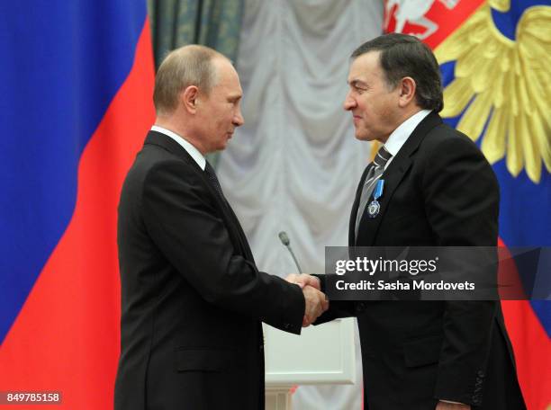 Russian President Vladimir Putin and billionaire Aras Agalarov seen during an awarding ceremony in the Kremlin in Moscow, Russia on October 29, 2013....