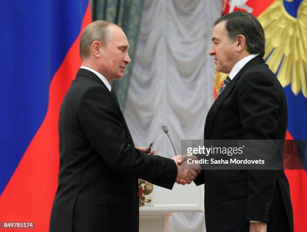 Russian President Vladimir Putin and billionaire Aras Agalarov seen during an awarding ceremony in the Kremlin in Moscow, Russia on October 29, 2013....