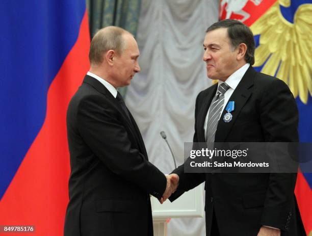 Russian President Vladimir Putin and billionaire Aras Agalarov seen during an awarding ceremony in the Kremlin in Moscow, Russia on October 29, 2013....