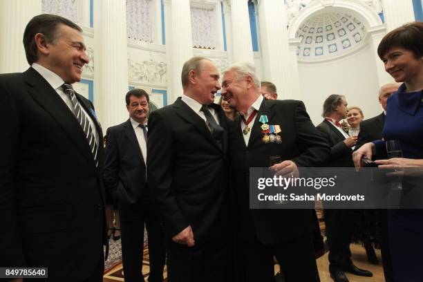 Russian President Vladimir Putin , actor Vladimir Vinokur and billionaire Aras Agalarov seen during an awarding ceremony in the Kremlin in Moscow,...