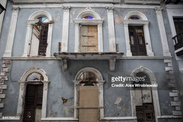 Damaged building stands in Old San Juan as residents prepare for a direct hit from Hurricane Maria on September 19, 2017 in San Juan, Puerto Rico....