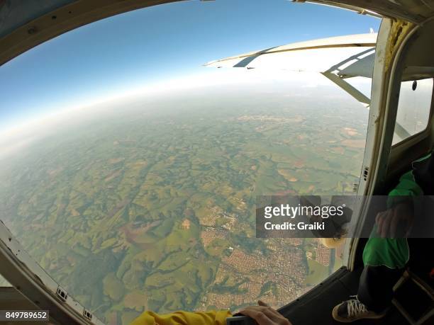 skydiver point of view of the open door of the airplane. - wings circle stock pictures, royalty-free photos & images