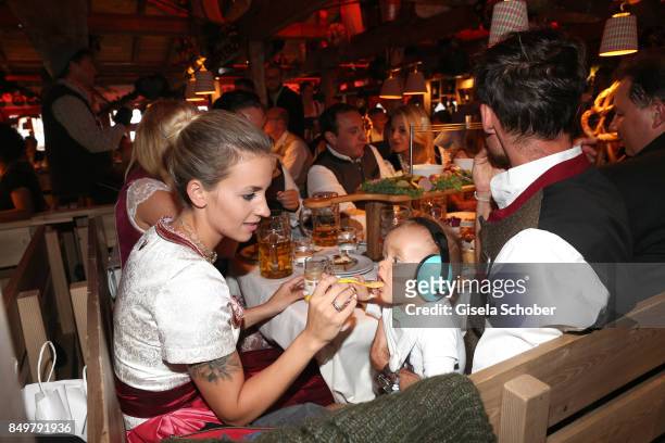 Sven Hannawald and his wife Melissa Hannawald and their son Glen during the "Alpenherz Wies'n" as part of the Oktoberfest at Theresienwiese on...