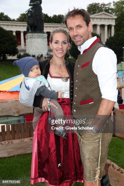 Sven Hannawald and his wife Melissa Hannawald and their son Glen during the "Alpenherz Wies'n" as part of the Oktoberfest at Theresienwiese on...