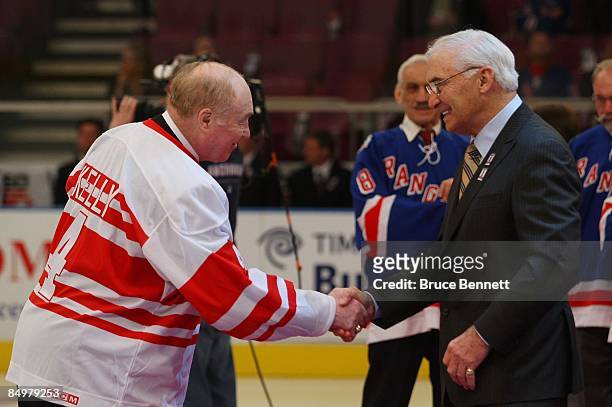 Former New York Ranger player Andy Bathgate shakes hands with Red Kelly duringa ceremony honoring Bathgate prior to the game between the Toronto...