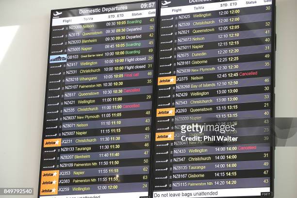 Departure signs show several cancelled domestic flights at Auckland Airport on September 20, 2017 in Auckland, New Zealand. Regular supplies to...