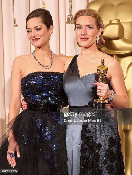 Actress Kate Winslet poses with Marion Cotillard after winning the Best Actress award for "The Reader" in the press room at the 81st Annual Academy...