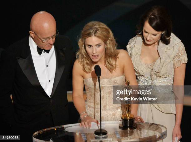 Kate Ledger , sister of late Heath Ledger, accepts the award for Best Supporting Actor for "The Dark Night" with father Kim and mother Sally during...