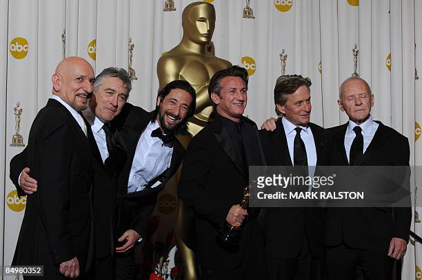 Best Actor winner Sean Penn poses with his trophy and former winners, from L to R, Ben Kingsley, Robert De Niro, Adrien Brody, Michael Douglas and...