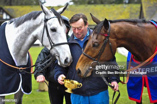 Simonsig Winner of the Racing Post Arkle Chase admires the Cheltenham Gold Cup 2013, won by Bobs Worth as trainer Nicky Henderson shows off the...