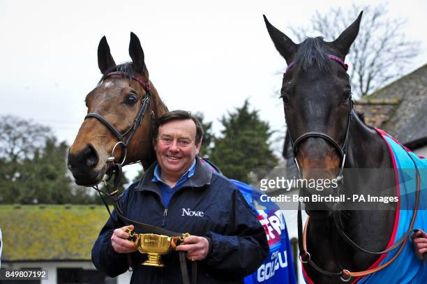 Cheltenham Gold Cup winner Bobs Worth and winner of the Queen Mother Champion Chase Sprinter Sacre with trainer Nicky Henderson as he shows off the...