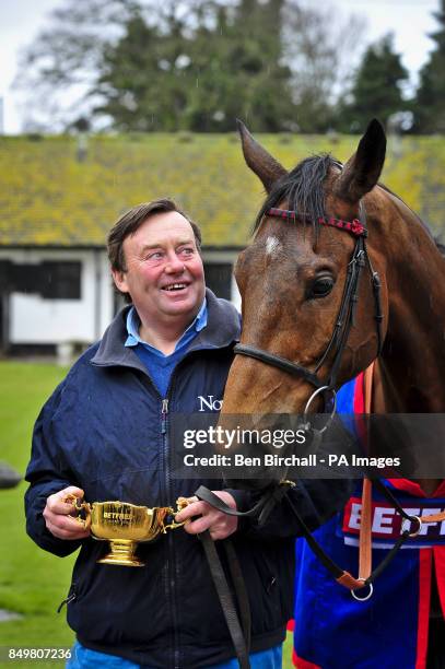 Winner of the Cheltenham Gold Cup 2013 Bobs Worth, with his trophy, held by trainer Nicky Henderson, during the homecoming parade at Nicky...