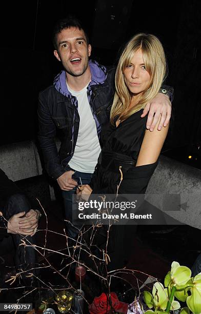 Brandon Flowers and Sienna Miller attend the afterparty following the Twenty8Twelve show during the London Fashion Week a/w 2009, at Whisky Mist on...