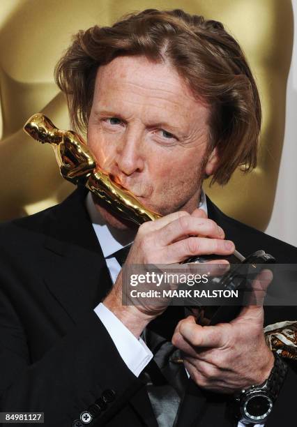 Winner for Best Cinematography in "Slumdog Millionaire" Anthony Dod Mantle kisses his Oscar at the 81st Academy Awards at the Kodak Theater in...