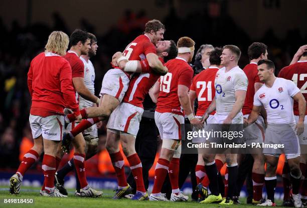 Wales Leigh Halfpenny and Sam Warburton celebrate at the final whistle during the RBS Six Nations match at the Millennium Stadium, Cardiff.