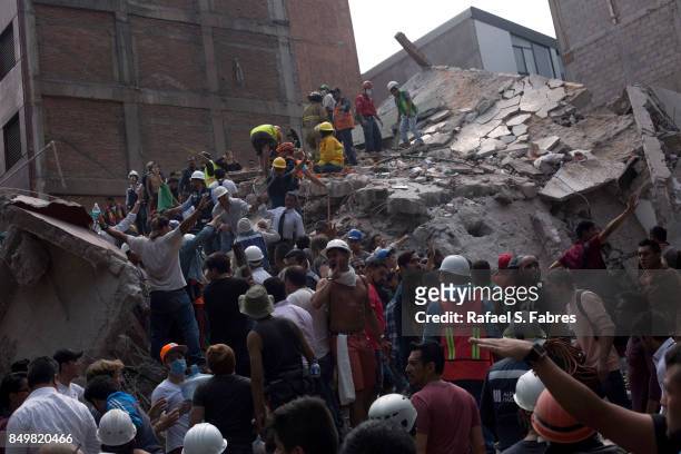 Rescuers work in the rubble after a magnitude 7.1 earthquake struck on September 19, 2017 in Mexico City, Mexico. The earthquake caused multiple...