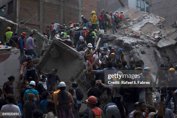 Rescuers work in the rubble after a magnitude 7.1 earthquake struck on September 19, 2017 in Mexico City, Mexico. The earthquake caused multiple...