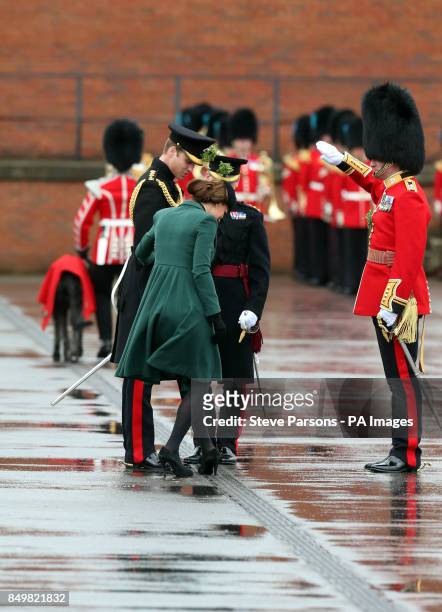 The Duchess of Cambridge gets her heel stuck in a drain as the Duke and Duchess of Cambridge visit the 1st Battalion Irish Guards to attend the St....