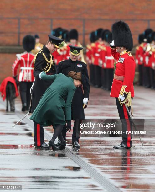 The Duchess of Cambridge gets her heel stuck in a drain as the Duke and Duchess of Cambridge visit the 1st Battalion Irish Guards to attend the St....