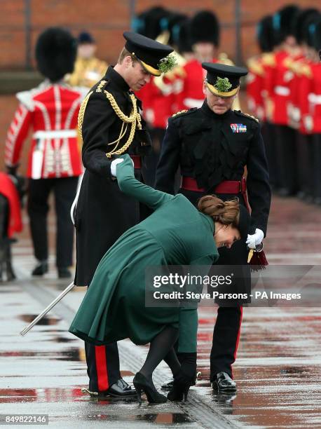 The Duchess of Cambridge gets her heel stuck in a drain as the Duke and Duchess of Cambridge visit the 1st Battalion Irish Guards to attend the St....