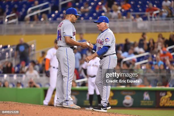Manager Terry Collins of the New York Mets takes the baseball from Pitcher AJ Ramos during the ninth inning against the Miami Marlins at Marlins Park...