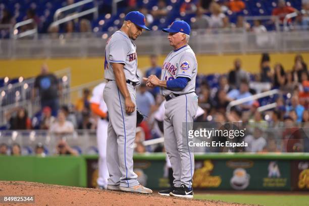 Manager Terry Collins of the New York Mets talks to pitcher AJ Ramos during the ninth inning against the Miami Marlins at Marlins Park on September...