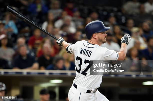 Travis Wood of the San Diego Padres hits a two RBI single during the third inning of a baseball game against the Arizona Diamondbacks at PETCO Park...