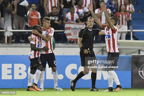 Yimmy Chara of Junior celebrates with teammates after scoring the third goal of his team during a second leg match between Junior and Cerro Porteño...