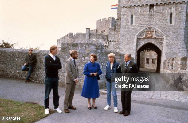 Prince Willem, flanked by his parents Queen Beatrix and Prince Claus of the Netherlands, meets his house master David Hobman and Dutch language...