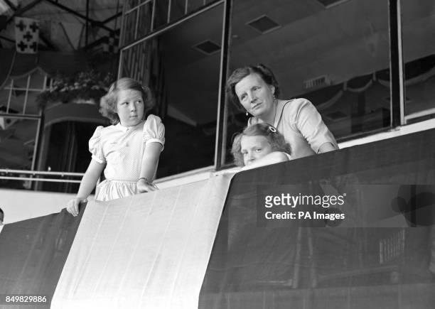 Queen Juliana of the Netherlands and her daughters Princess Beatrix and Princess Irene watch the riding at the International Horse Show in White...