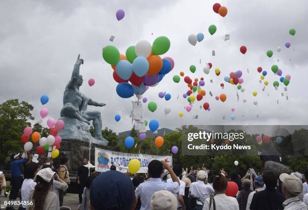 People release balloons at the Nagasaki Peace Park on Sept. 20 in the atomic-bombed southwestern Japan city of Nagasaki during a signature-collecting...