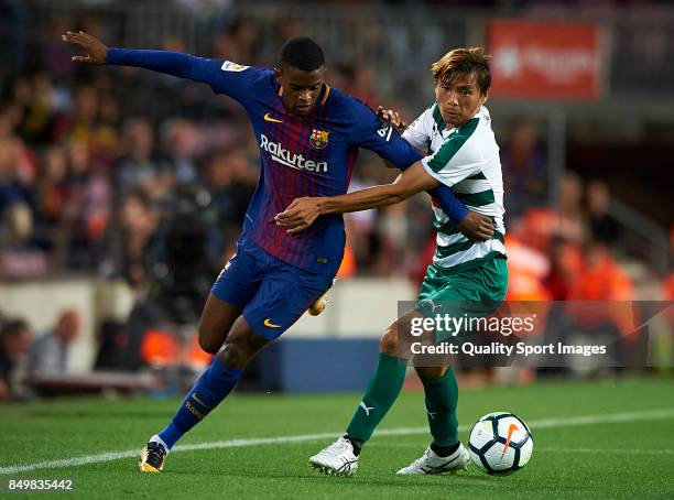 Nelson Semedo of Barcelona competes for the ball with Takashi Inui of Eibar during the La Liga match between Barcelona and Eibar at Camp Nou on...