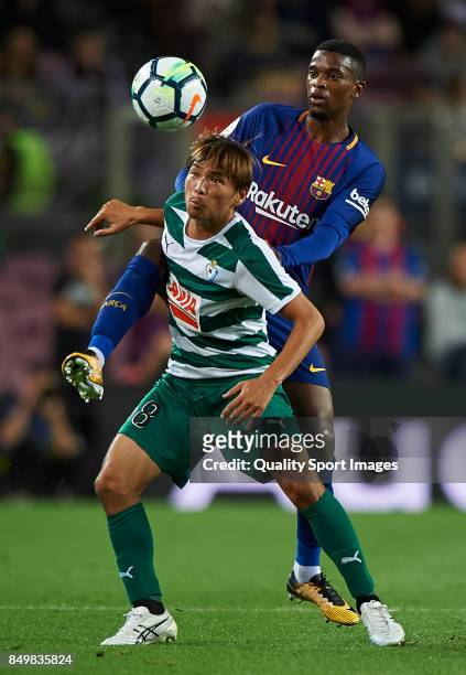 Nelson Semedo of Barcelona competes for the ball with Takashi Inui of Eibar during the La Liga match between Barcelona and Eibar at Camp Nou on...