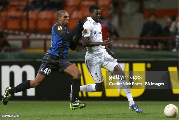 Tottenham Hotspur's Emmanuel Adebayor wins the ball ahead of Inter Milan's Juan