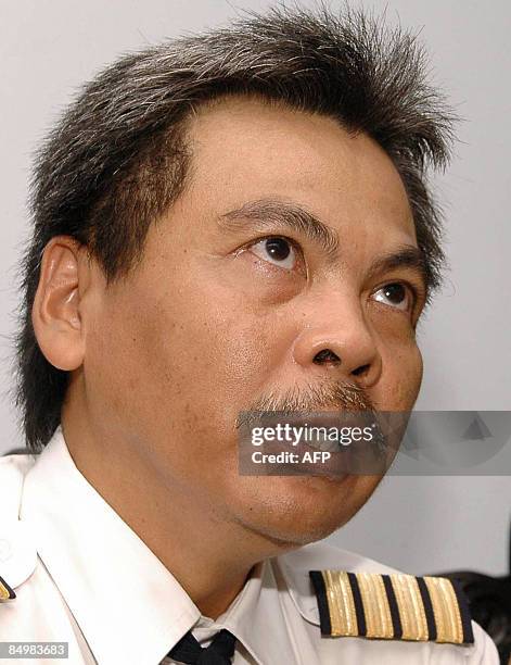 Former Garuda Indonesia pilot, Marwoto Komar, answers journalists questions after his trial in Yogyakarta on February 23, 2009. Indonesian...