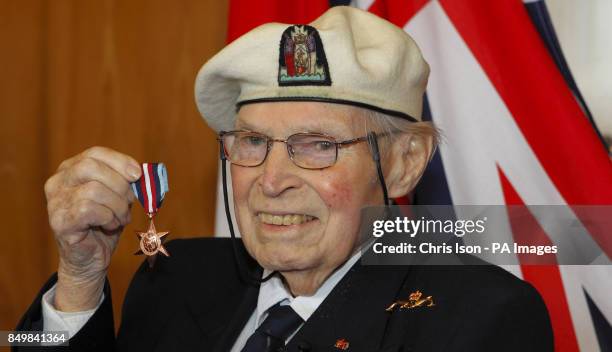 Arctic convoy veteran Eddie Grenfell with his Arctic Star medal which he received from General Sir David Richards, Chief of the Defence Staff at the...