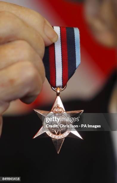 Arctic convoy veteran Eddie Grenfell with his Arctic Star medal which he received from General Sir David Richards, Chief of the Defence Staff at the...