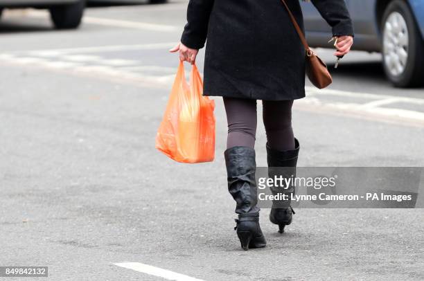 General view of a woman with Sainsbury's shopping in Macclesfield after the chain posted better-than-expected sales figures, after a quarter in which...