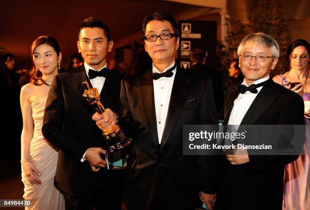 Actress Ryoko Hirosue, actor Masahiro Motoki, director Yojiro Takita and producer Ichiro Nobukuni attend the 81st Annual Academy Awards Governor's...