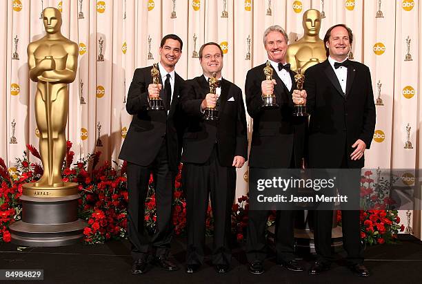 Visual effects artists Eric Barba, Steve Preeg, Burt Dalton and Craig Barron pose in the press room with their Best Visual Effects award for "The...