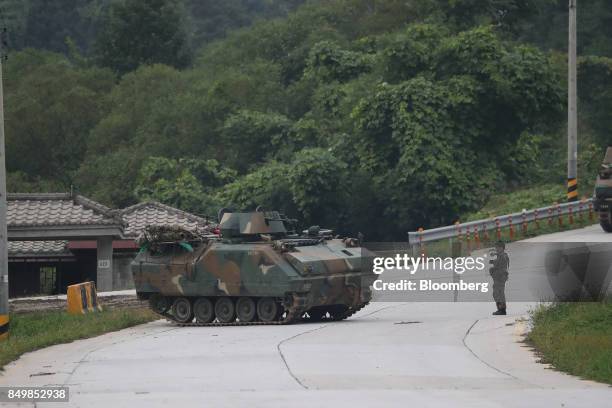 South Korean army soldier guides an armored vehicle as it moves on the road during Warrior Strike VIII, a bilateral training exercise between the...