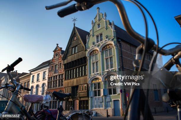 Buildings and houses along the canal channel waterway boat in Mechelen at sunset, Flanders, Belgium..