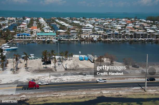 In this handout photo provided by the Florida Keys News Bureau, Traffic rolls on a repaired section of the Florida Keys Overseas Highway on September...